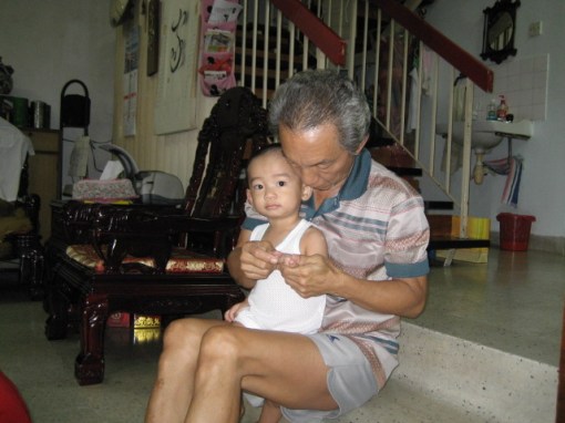 My dad checking Jason's dirty hands for food scraps in the nails.